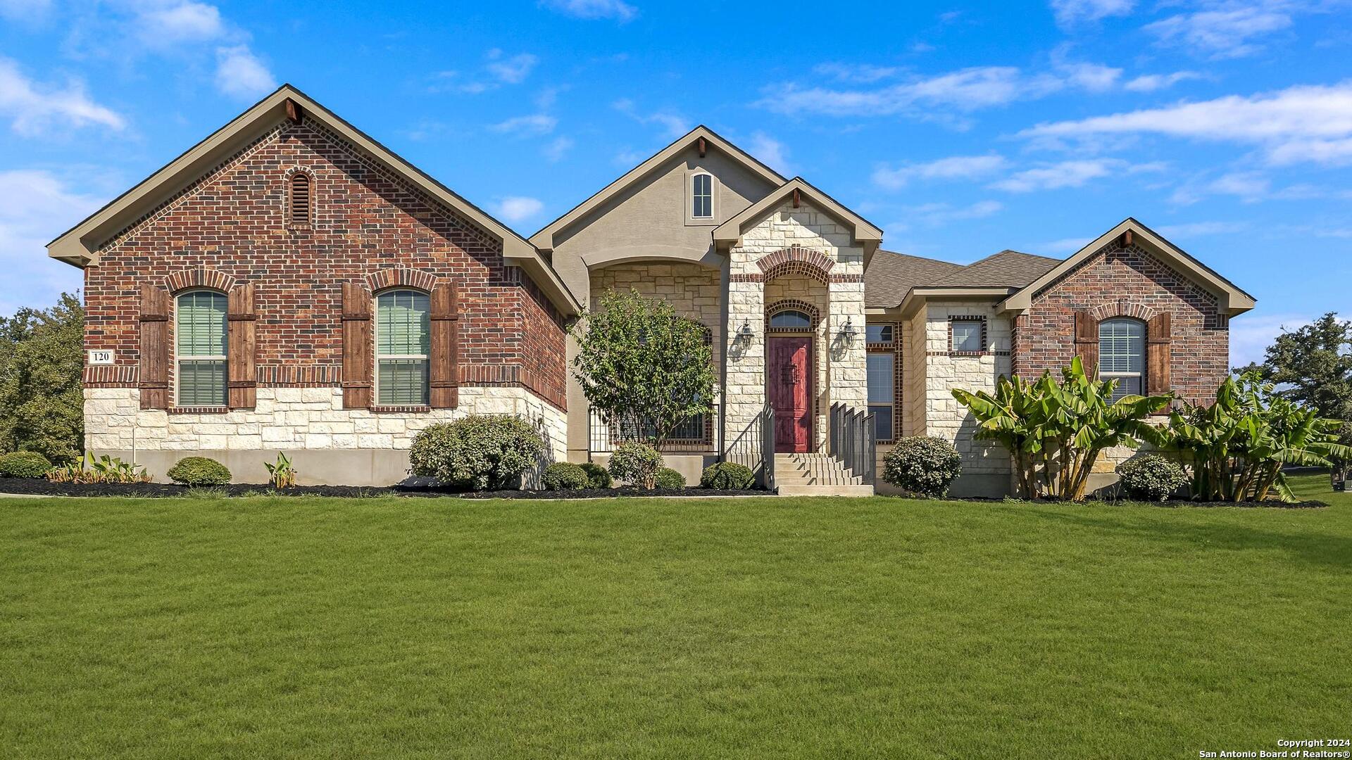 a front view of a house with a yard