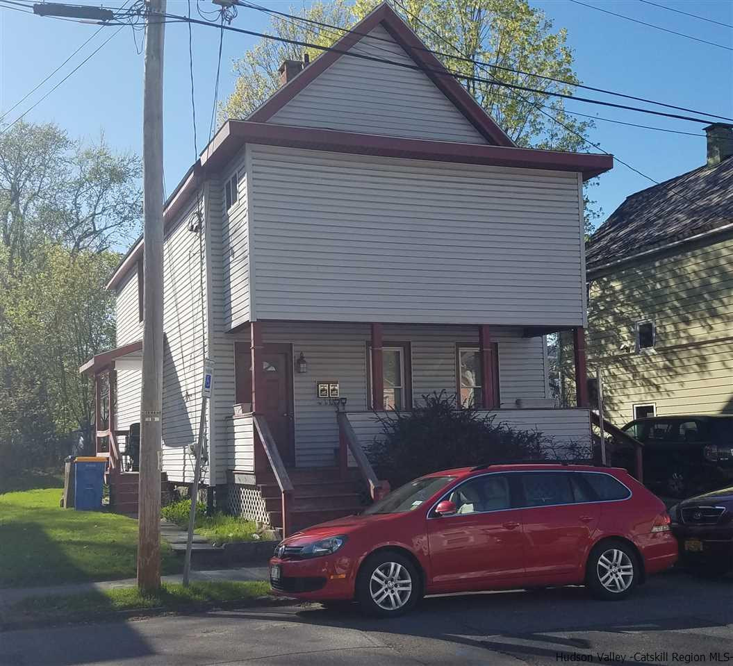 a car parked in front of a house