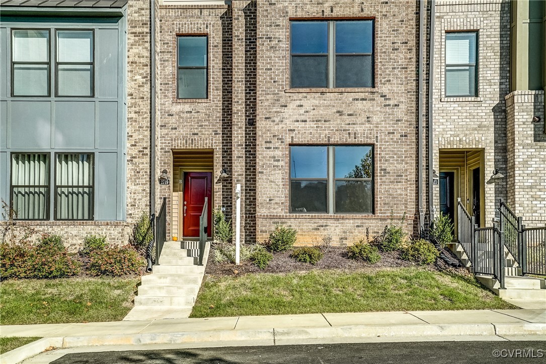 a front view of a house with stairs