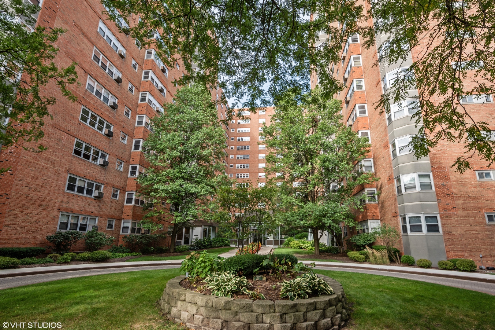 a garden with a building in the background