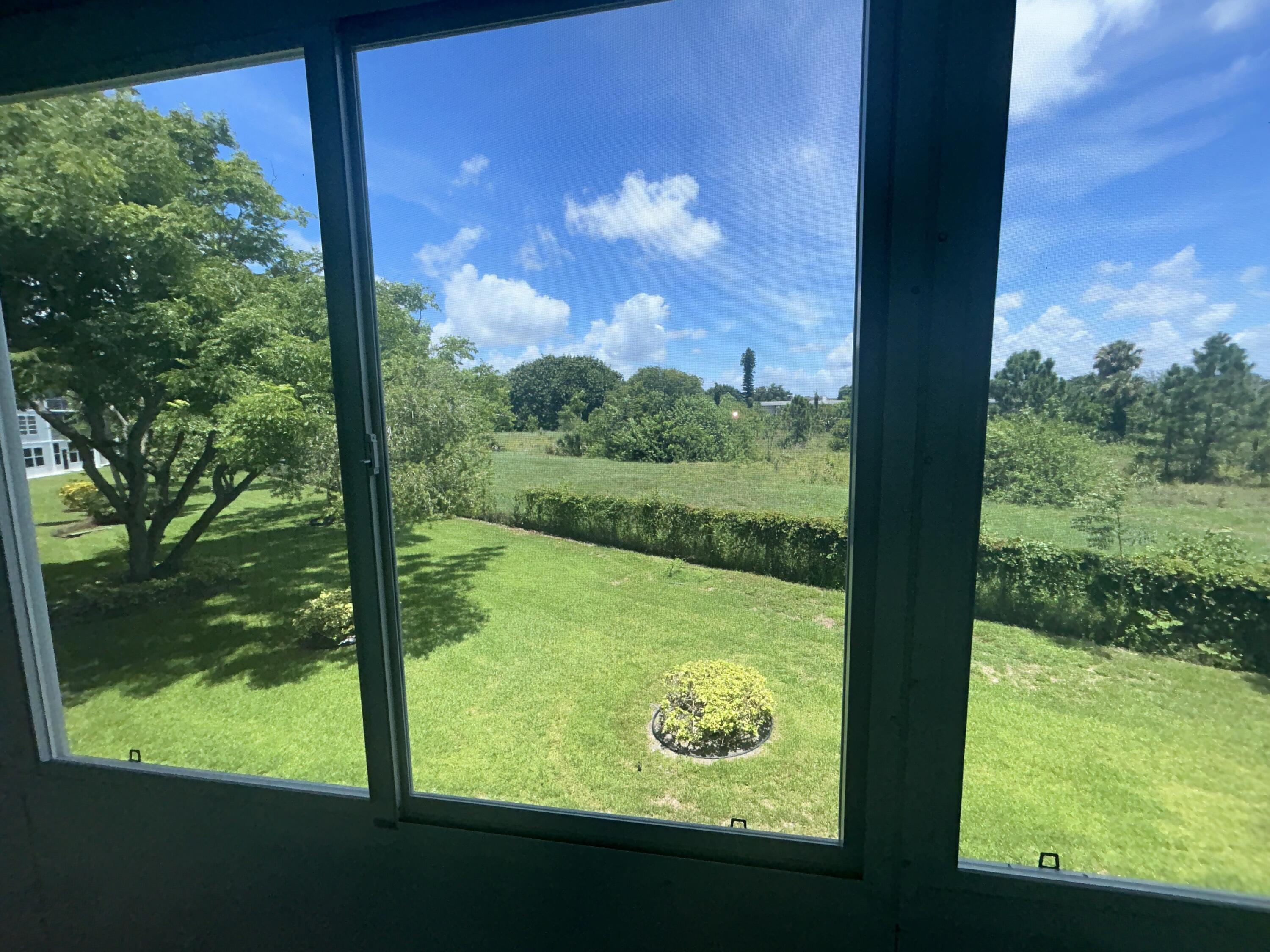 a view of back yard from a room