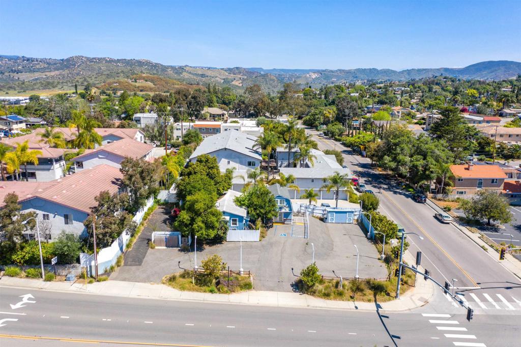 an aerial view of residential houses with outdoor space