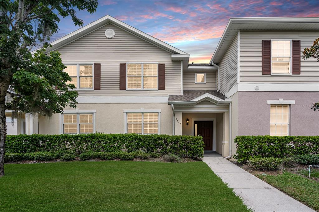 a front view of a house with a yard