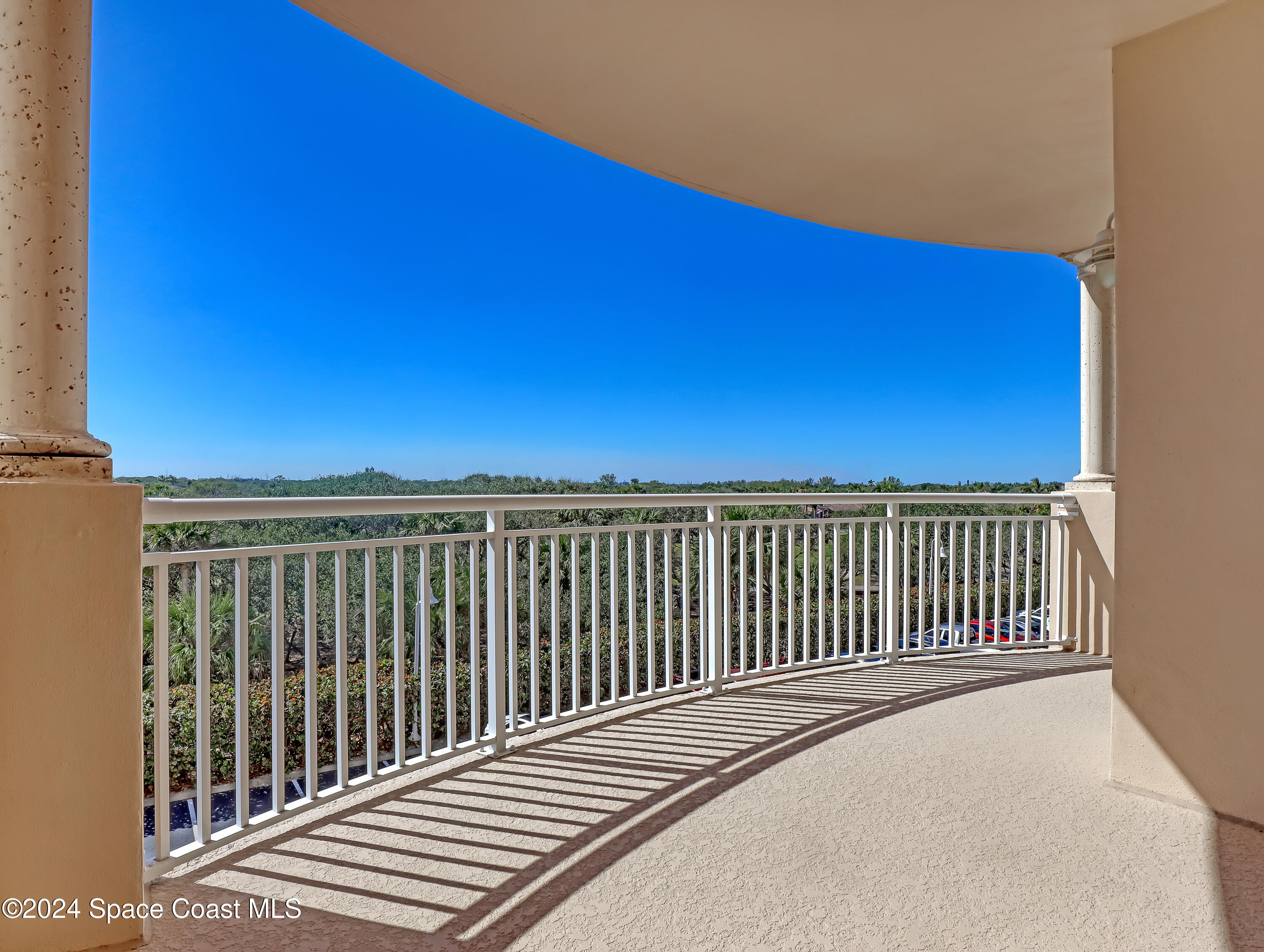 a view of a balcony with an outdoor space