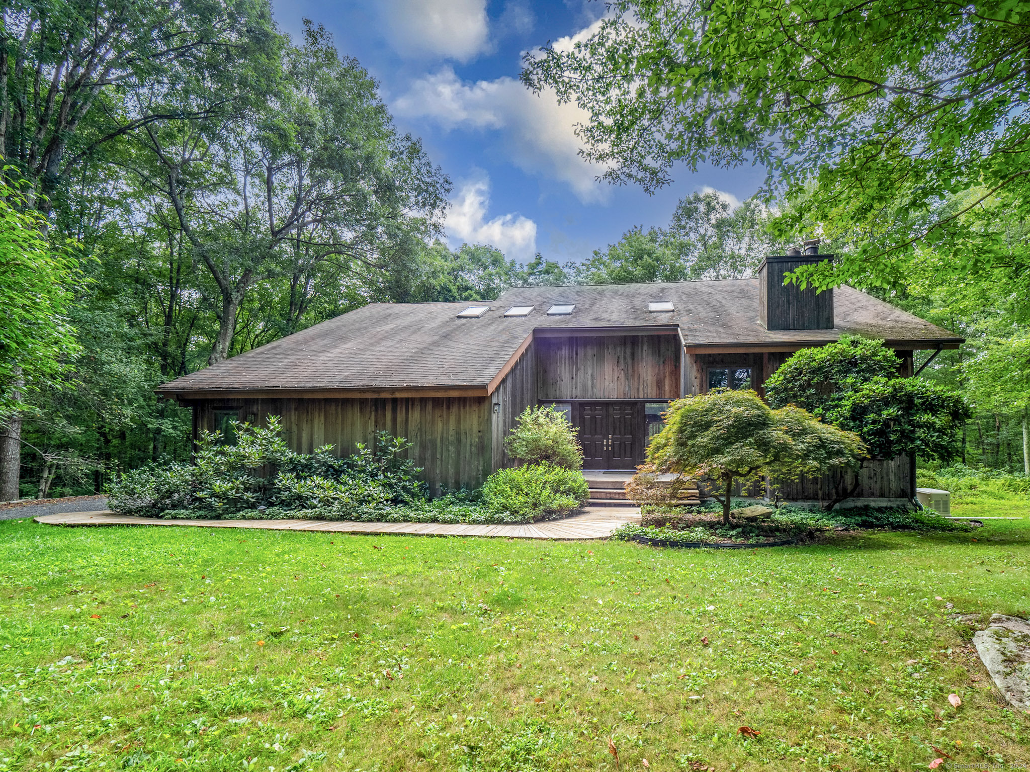 a view of a house with a garden