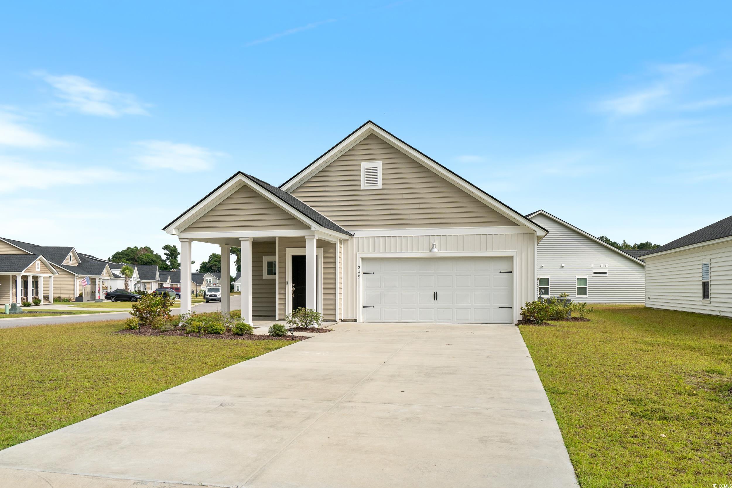 View of front of home featuring a front yard and a