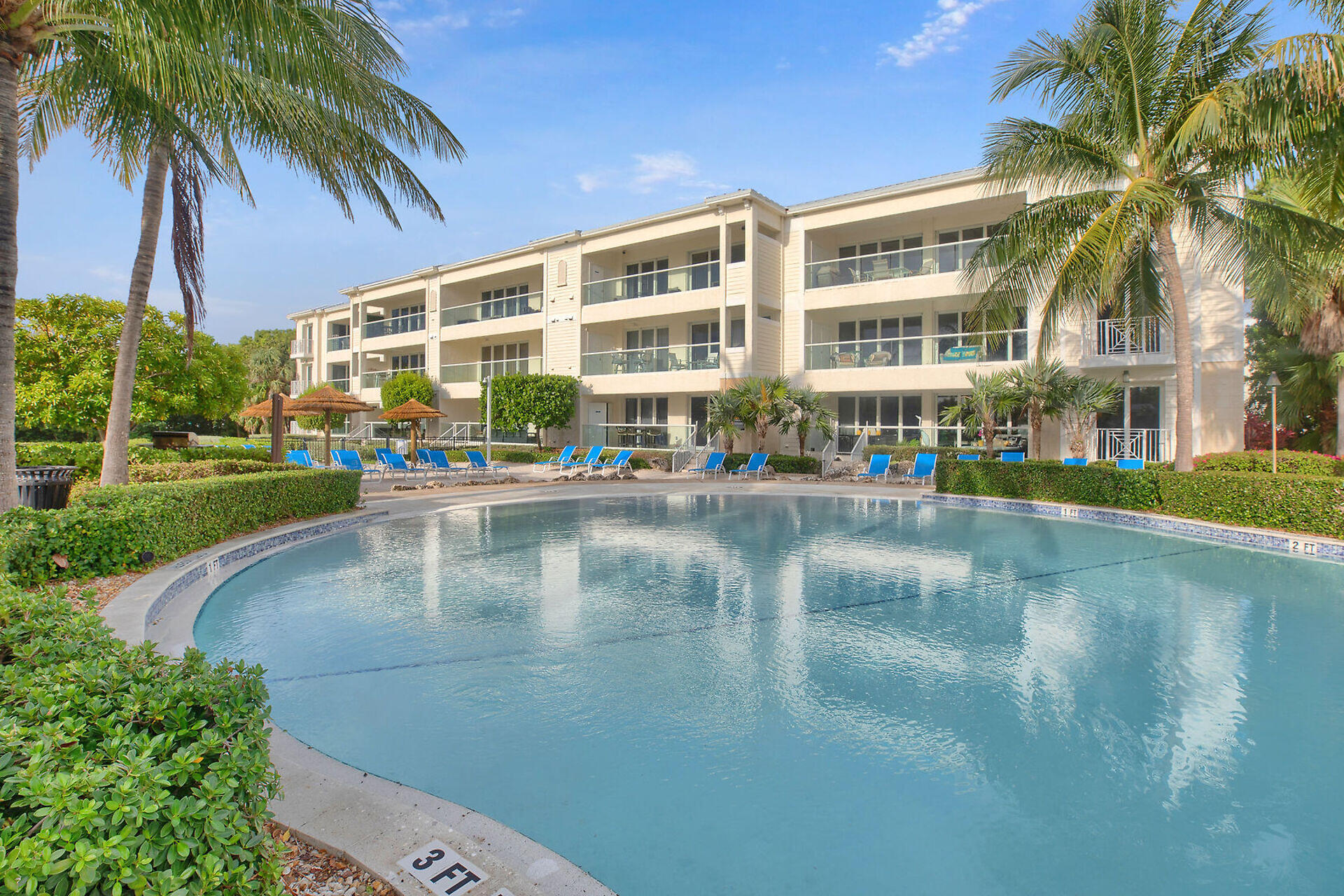 a swimming pool with outdoor seating and yard