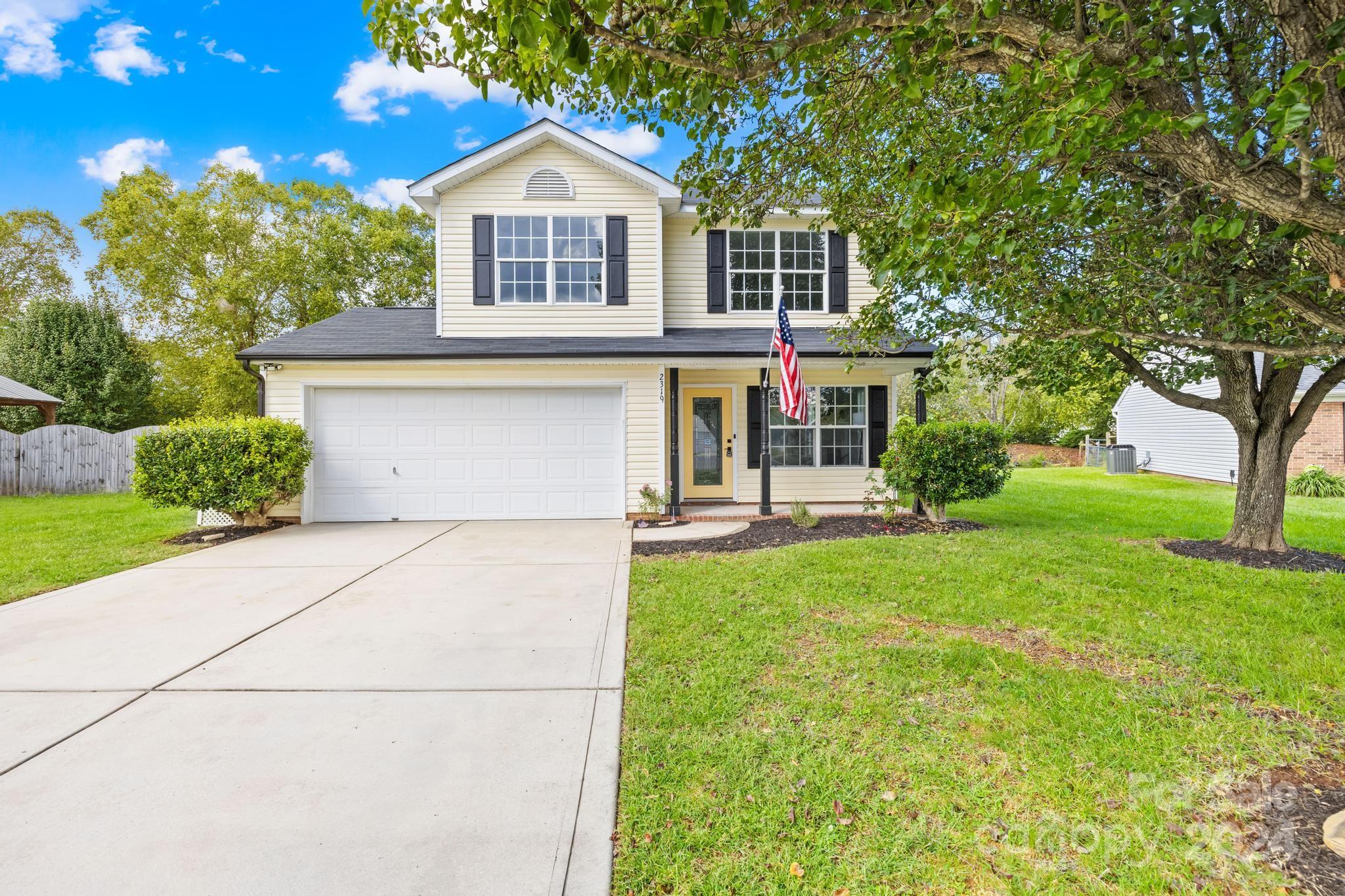 a front view of a house with yard