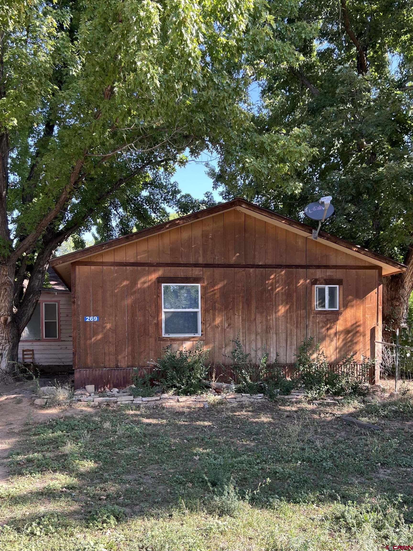 a front view of house with garden