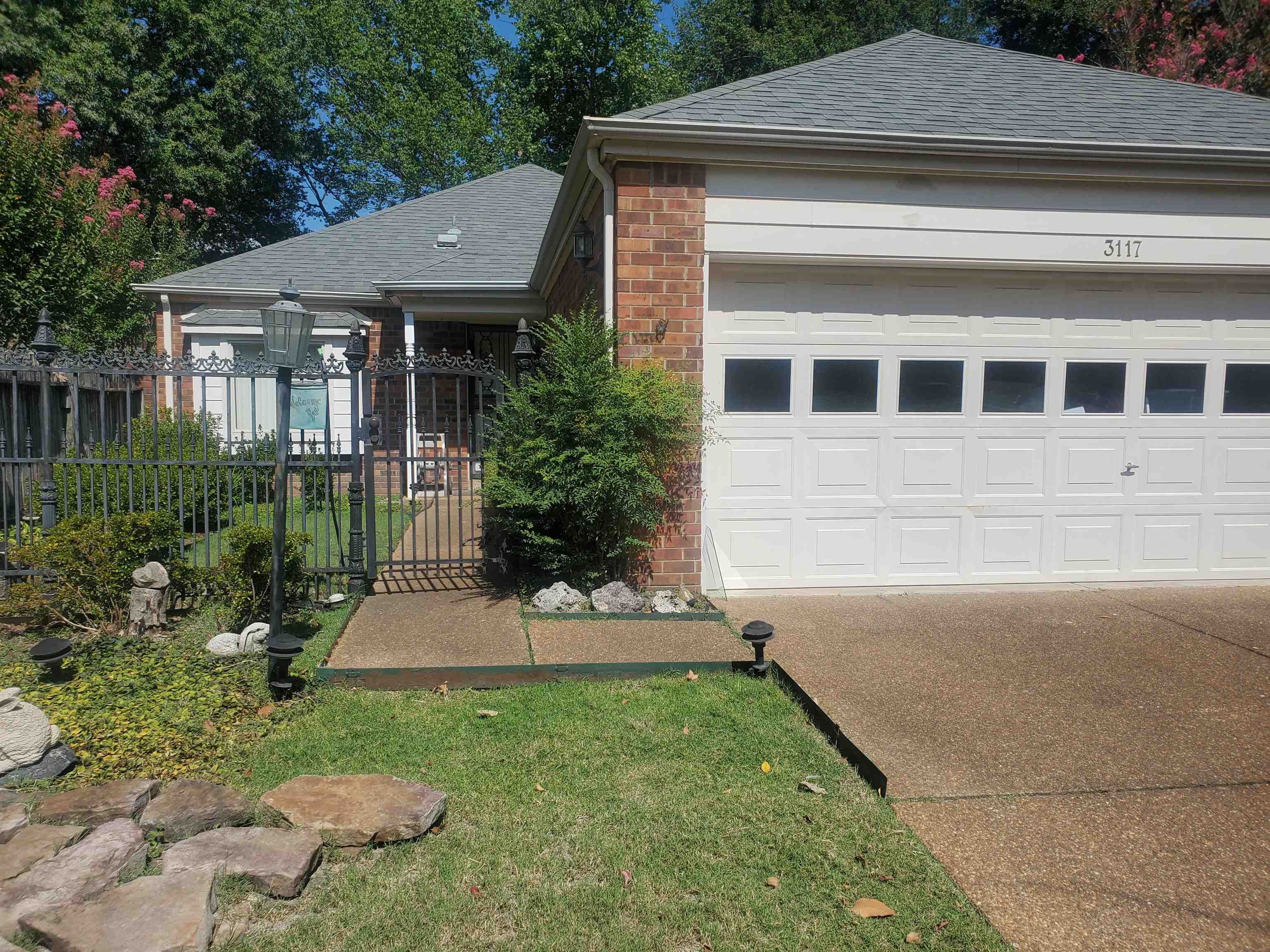 View of front facade featuring a garage