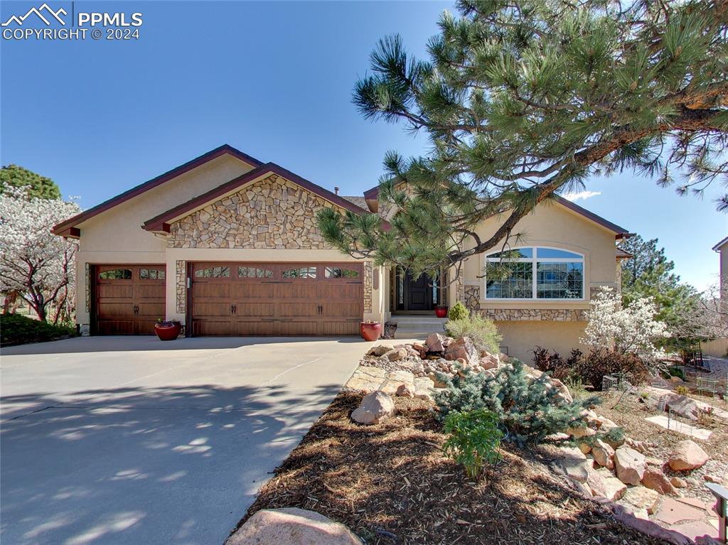 View of front of property featuring a garage