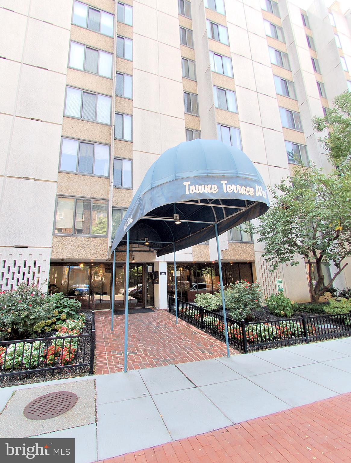 a view of building with an outdoor space and seating area