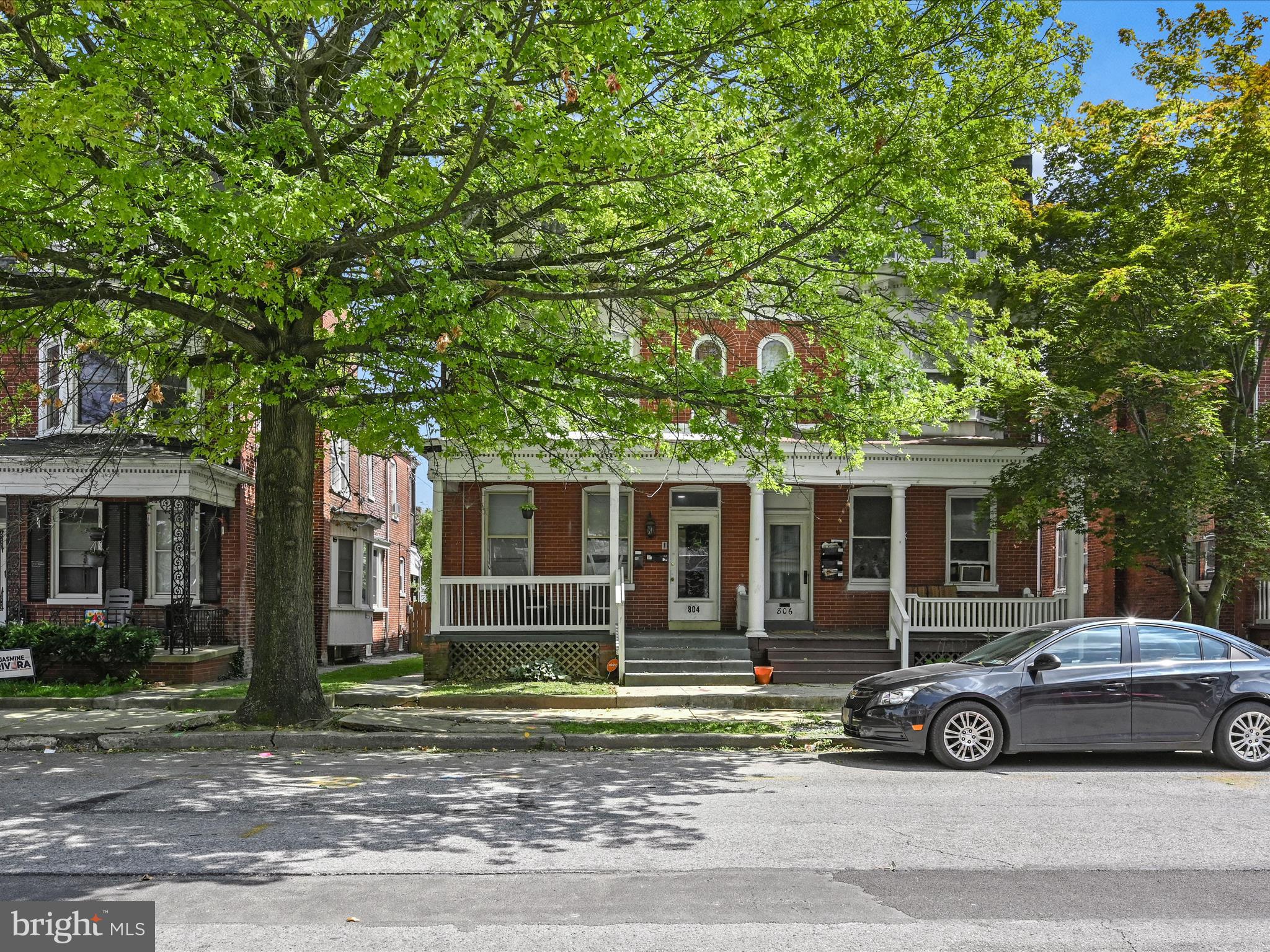 a car parked in front of a house