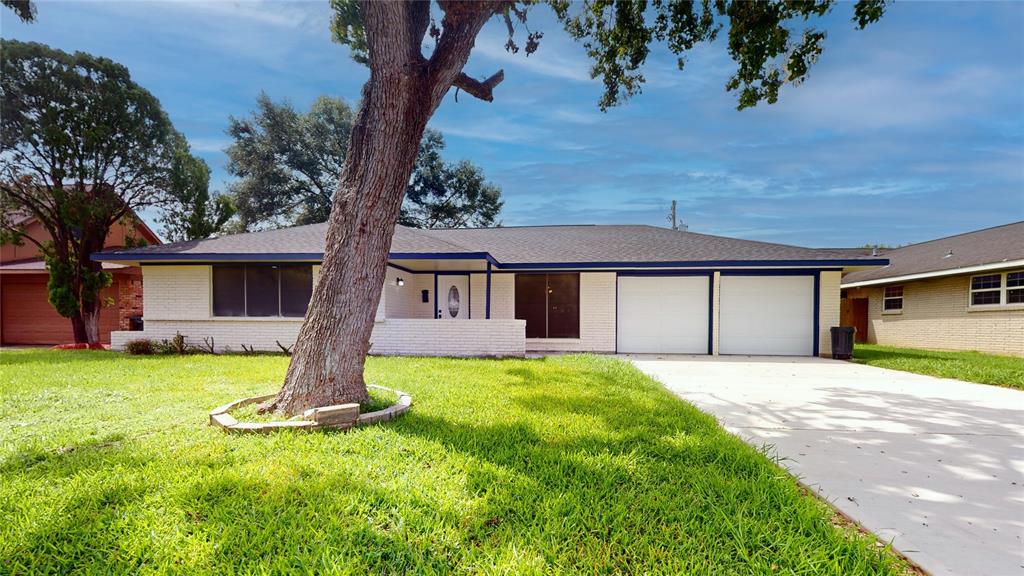 Two-car garage New Garage doors with Openers, and a elegant front yard.