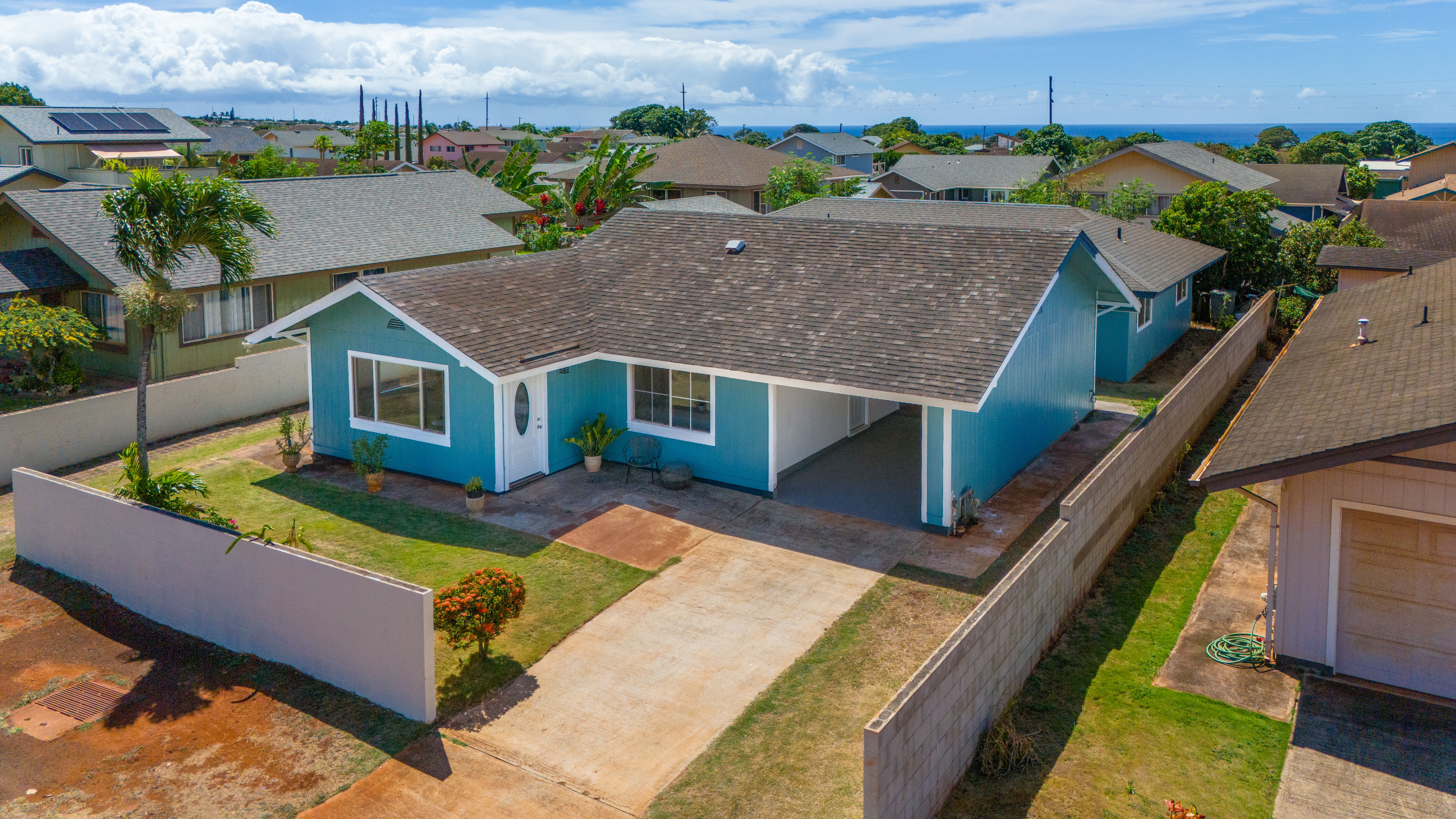 an aerial view of a house with a big yard