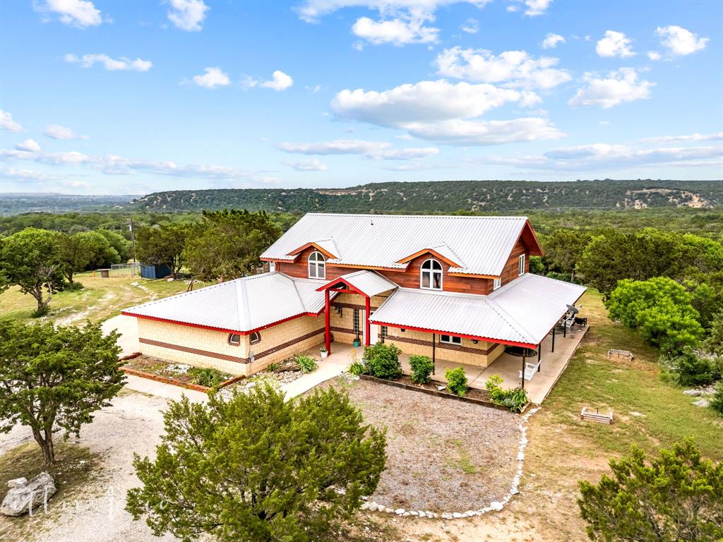 an aerial view of a house with outdoor space