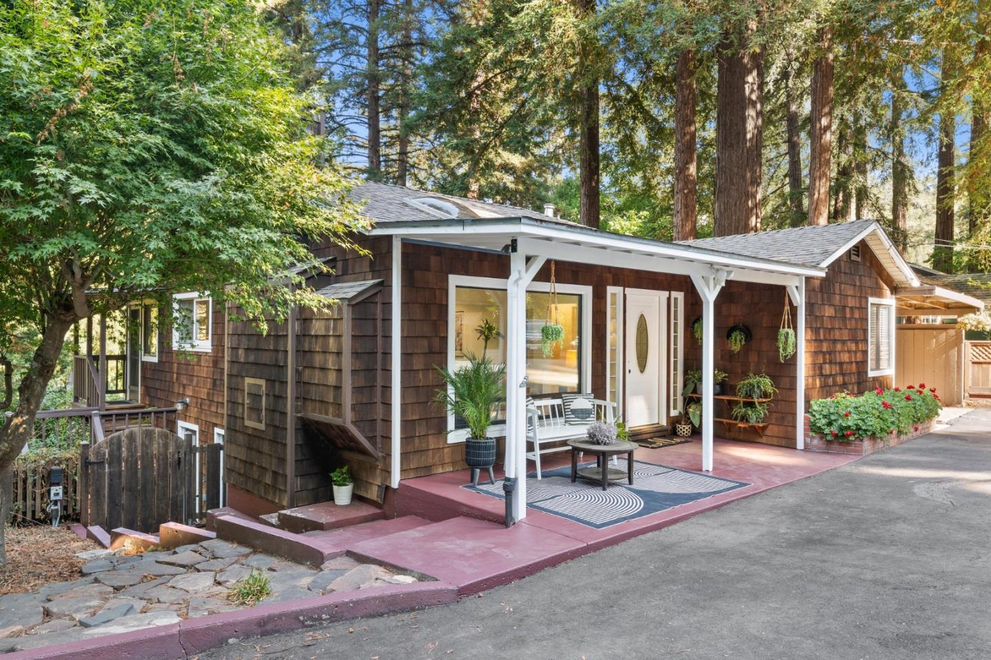 a view of a house with backyard porch and furniture