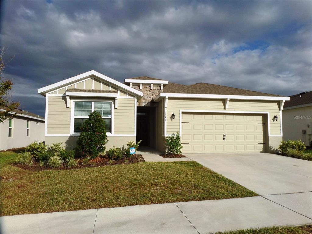 front view of a house with a yard