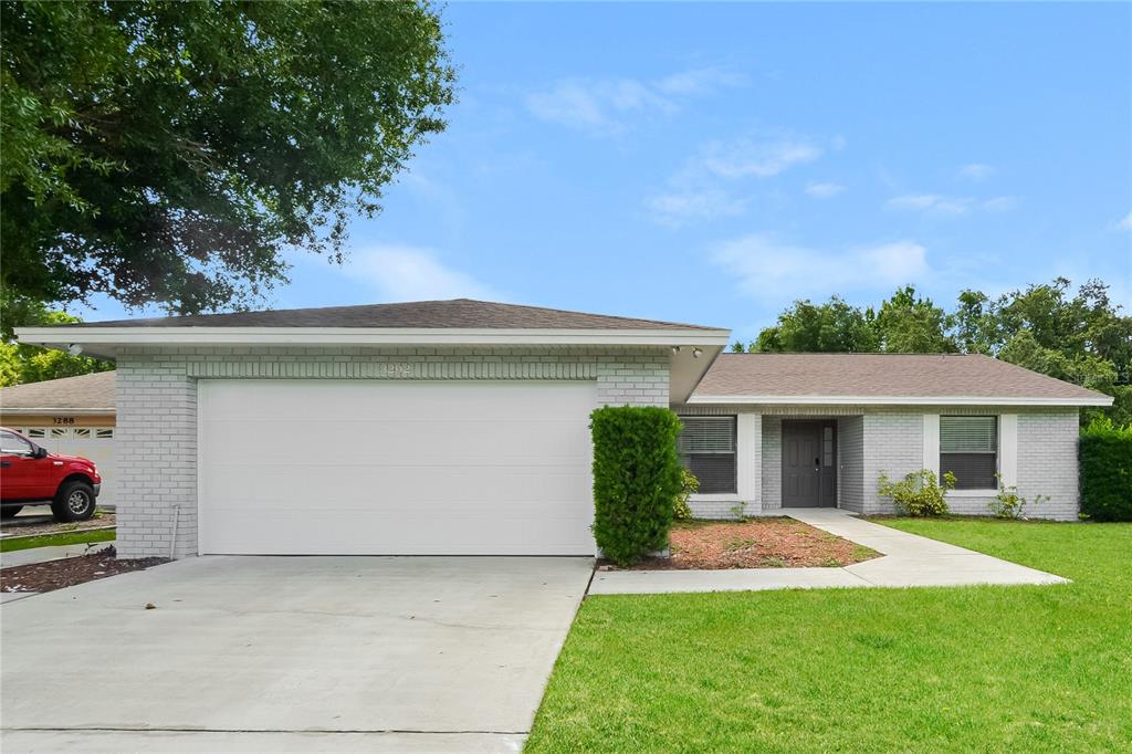 front view of a house with a yard