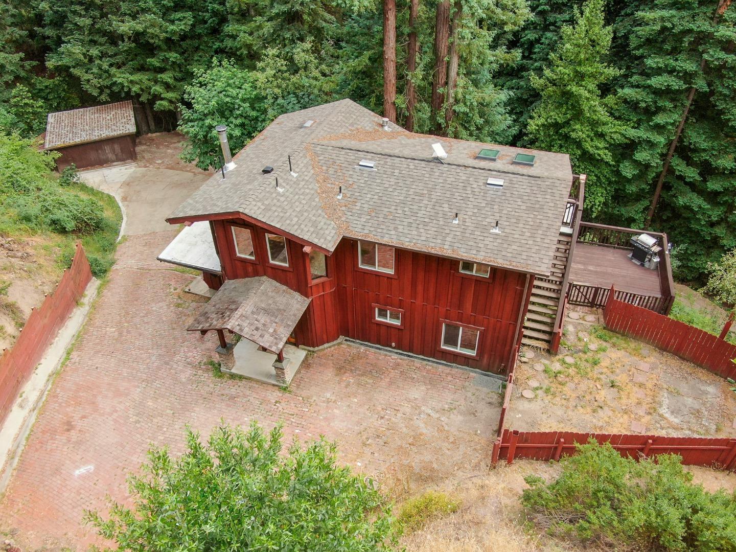 an aerial view of a chairs and table in the backyard