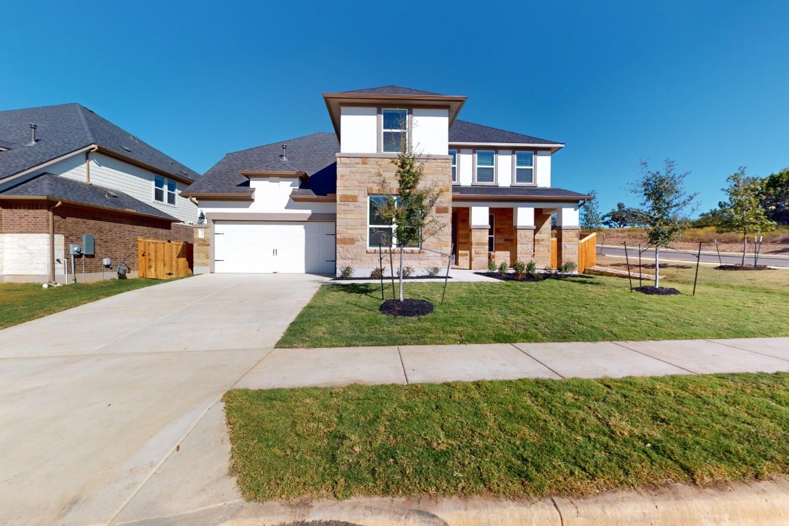 front view of a house with a yard