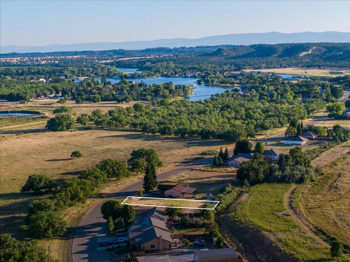 an aerial view of a house with a lake view