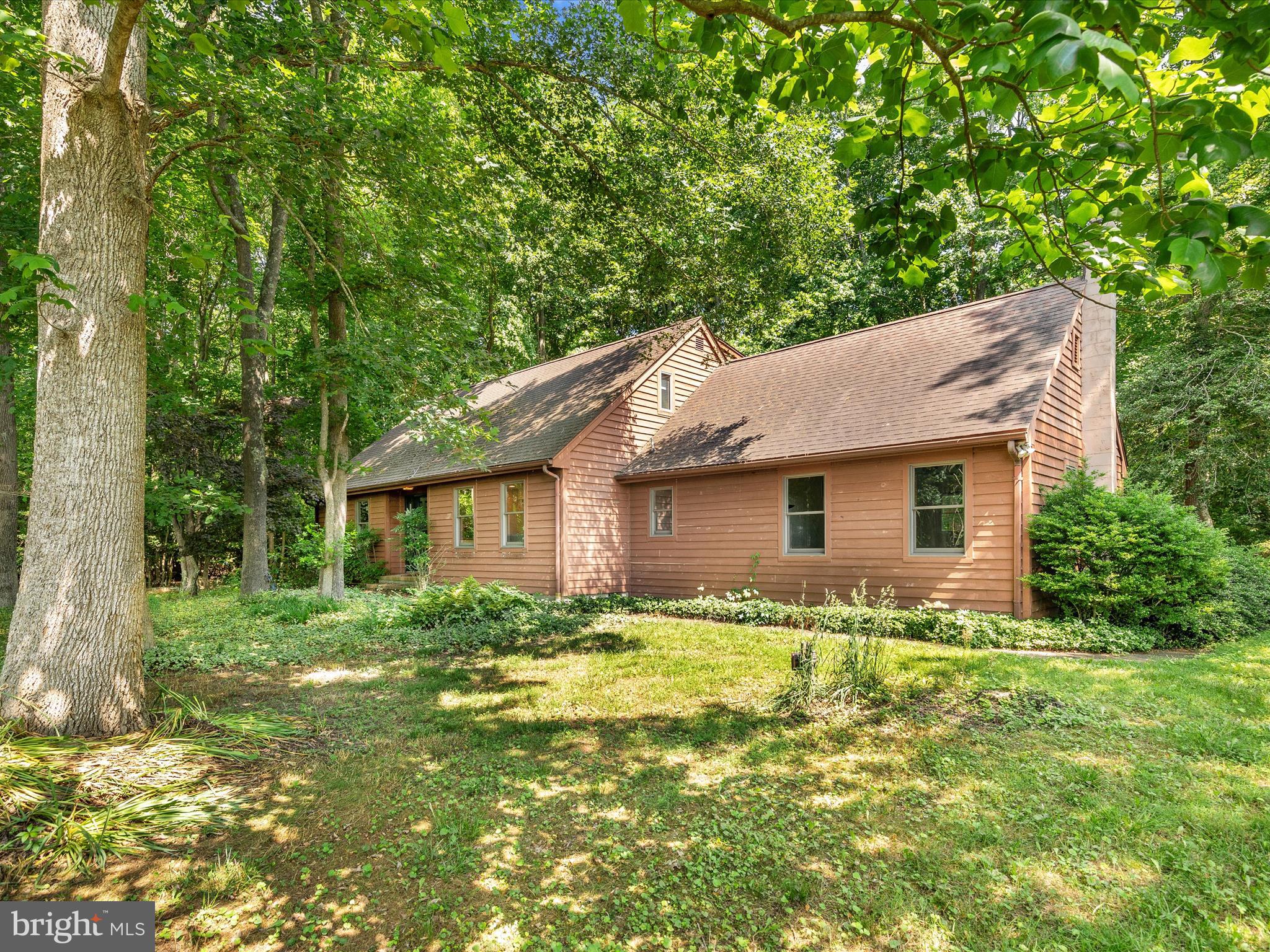 a house with trees in the background