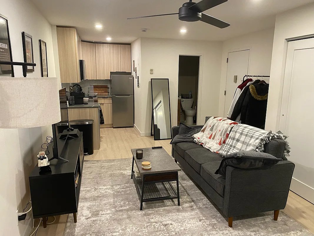 a living room with furniture and a table