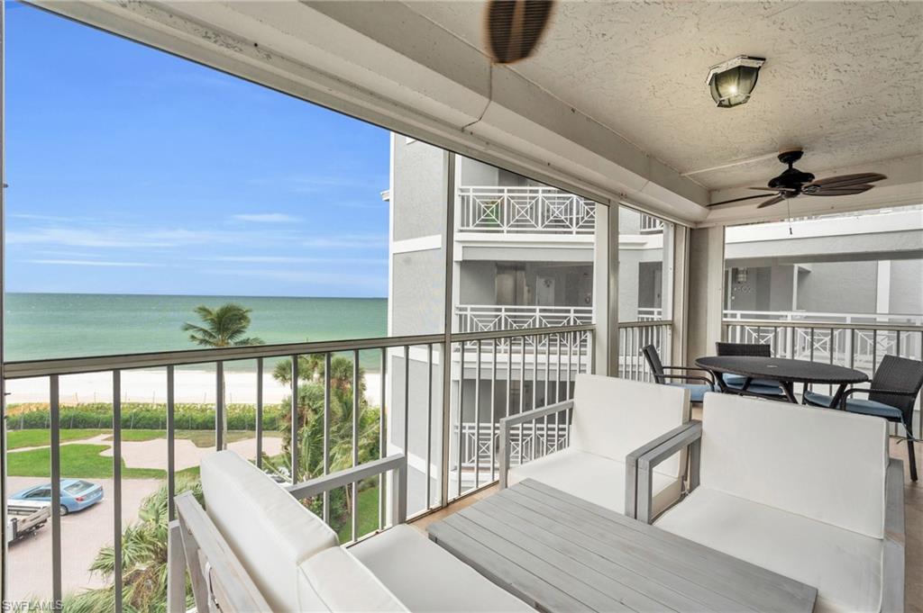 a view of a living room and balcony