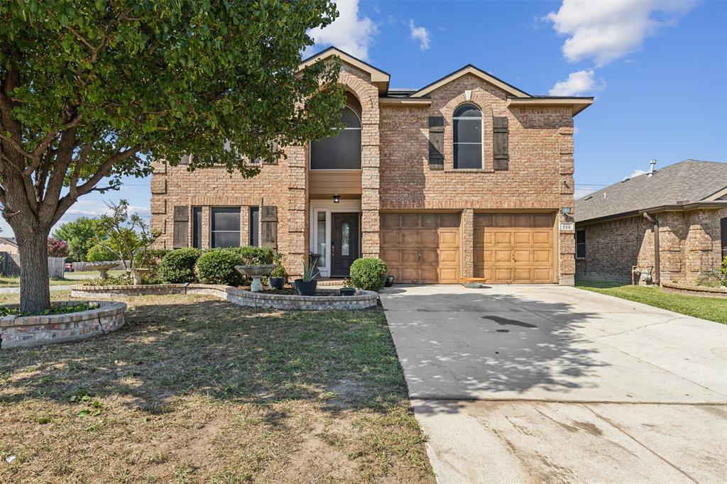 a front view of a house with yard