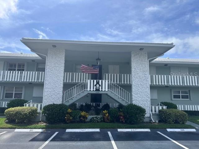 a front view of a building with garden