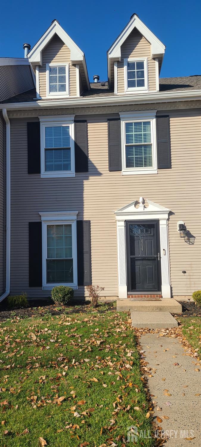 a front view of a house with yard