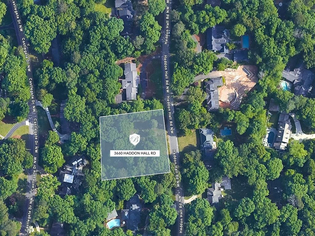 an aerial view of a house with yard outdoor seating and lake view