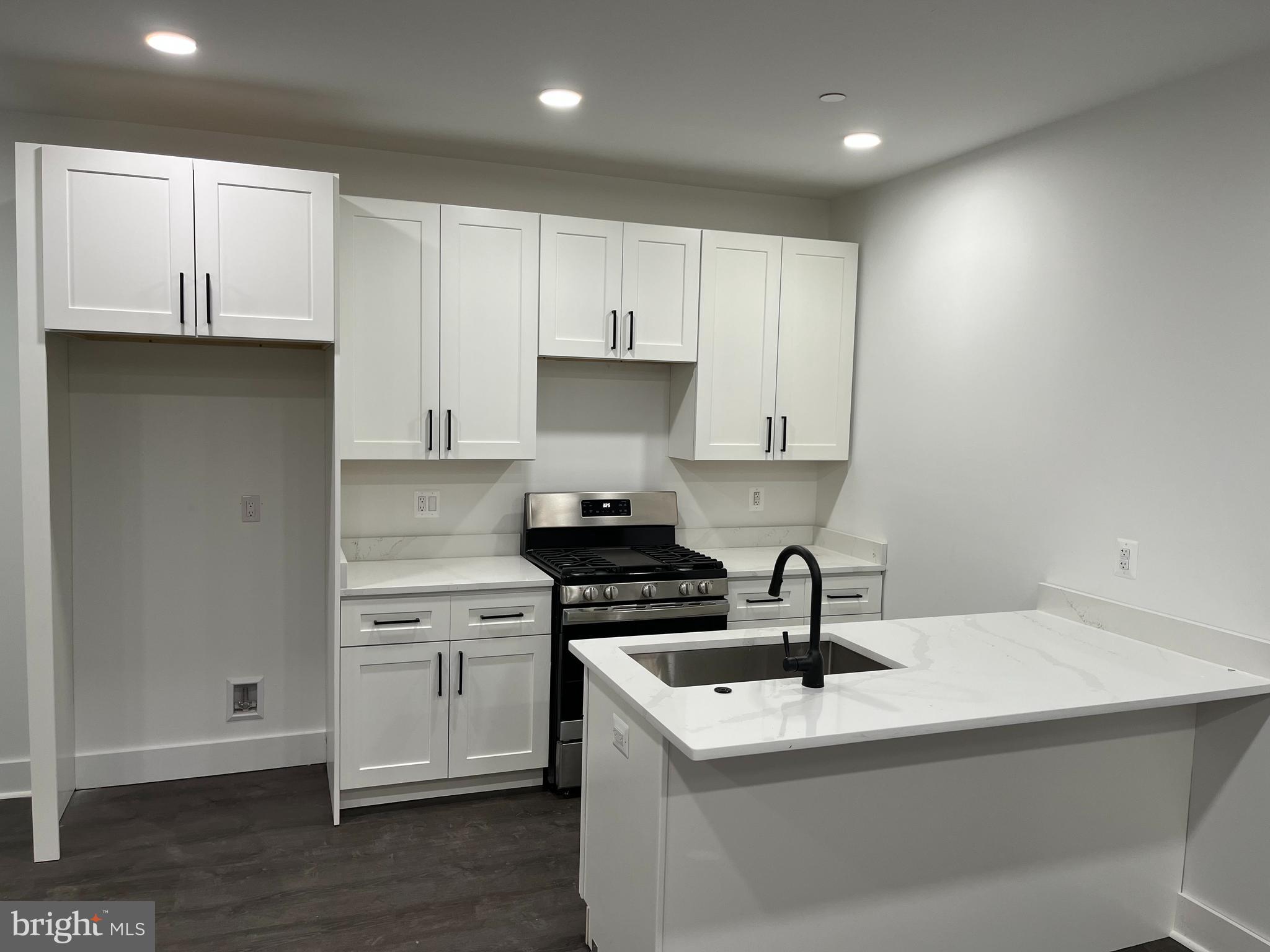 a kitchen with a sink and cabinets