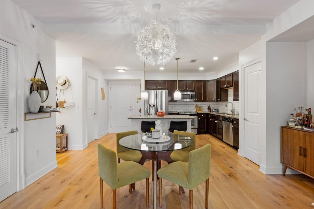 a view of a dining room with furniture and wooden floor