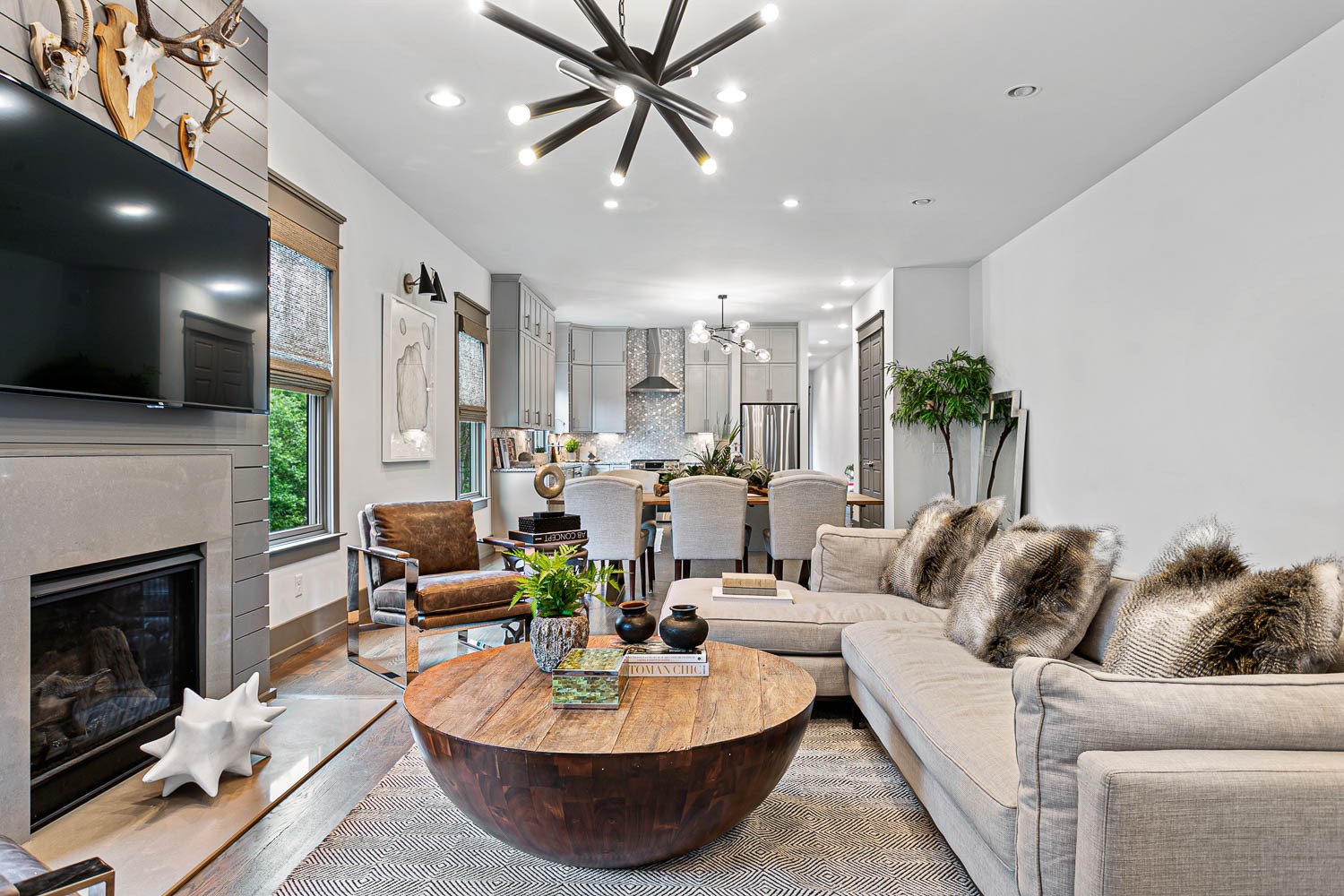 a living room with furniture and a fireplace