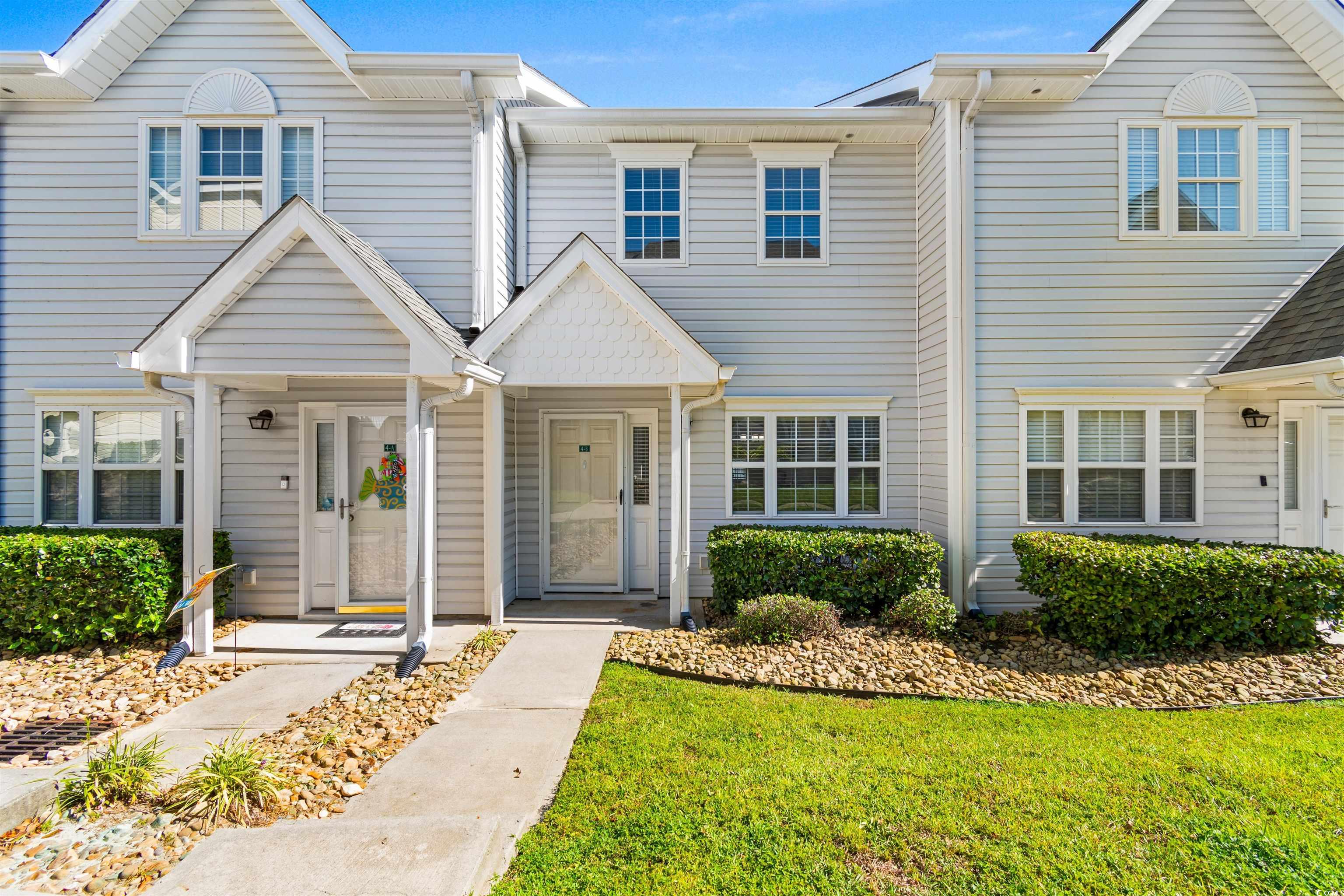 View of property featuring a front yard