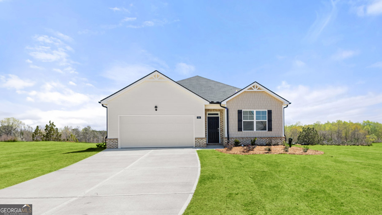 a front view of house with yard and green space