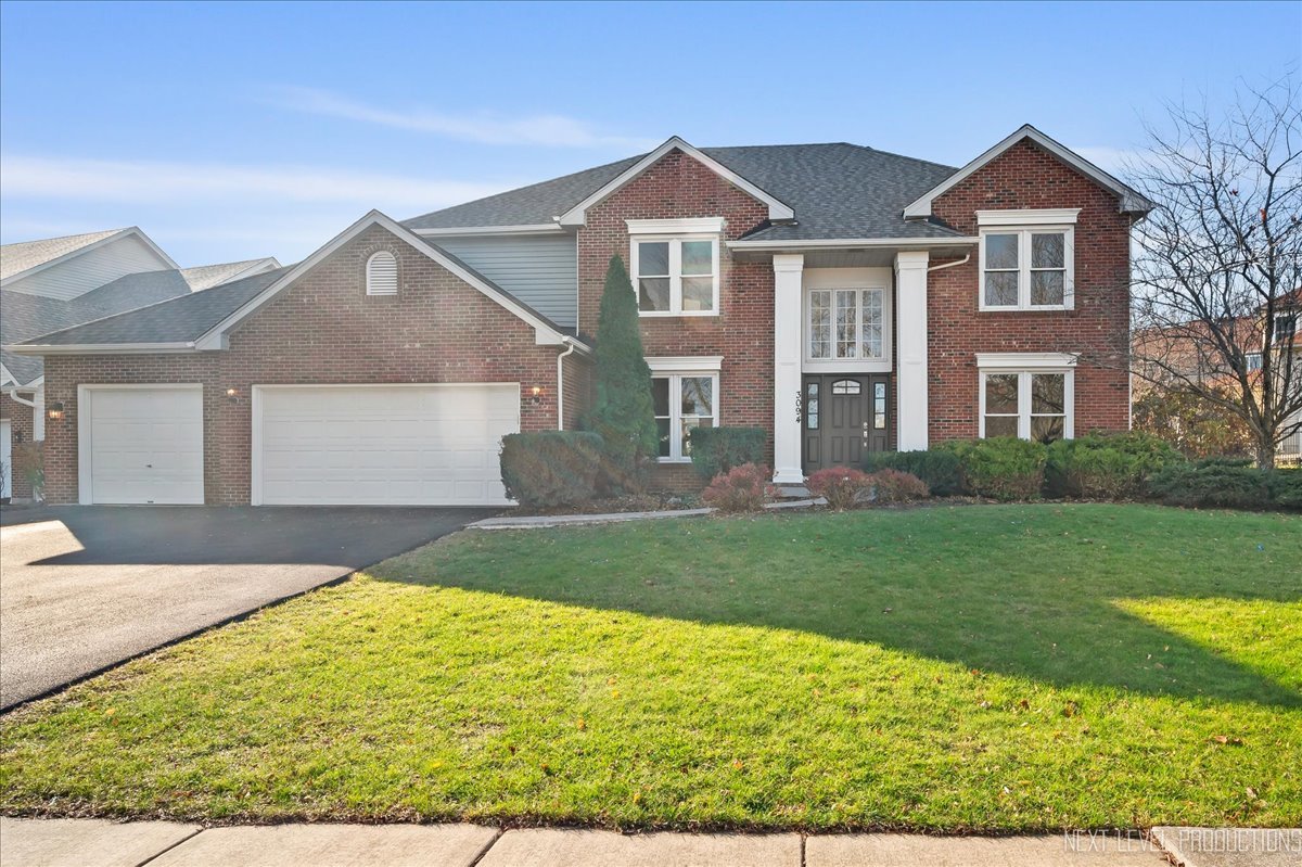 front view of a house with a yard