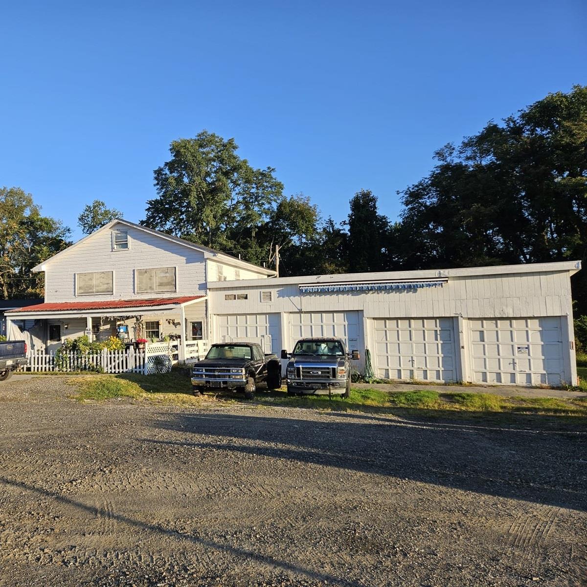 a view of house with outdoor space and porch