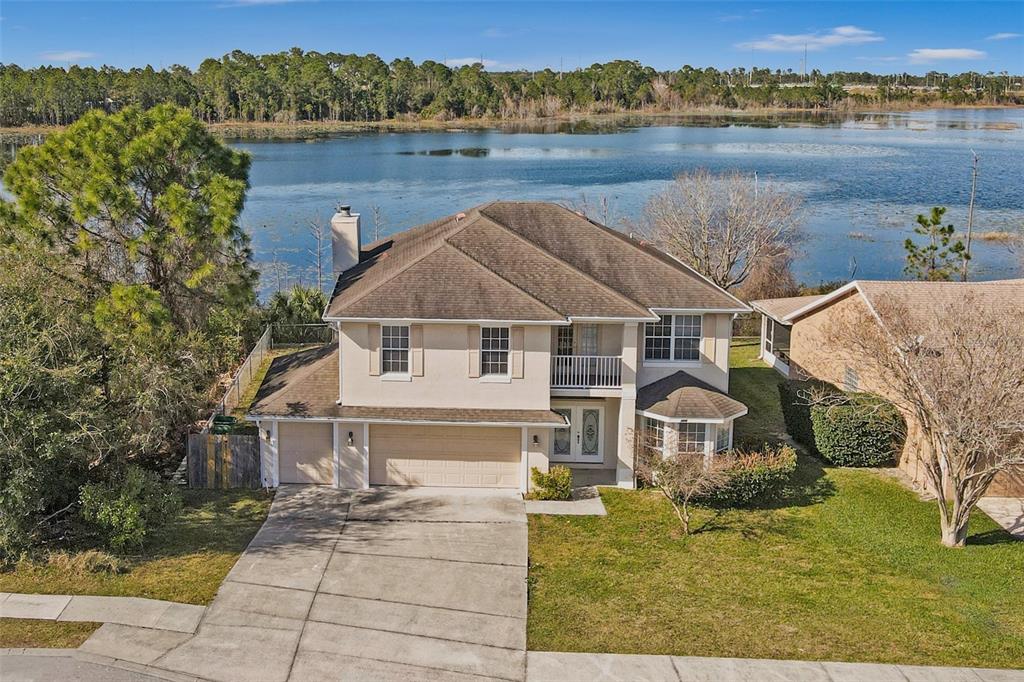 a aerial view of a house with a yard