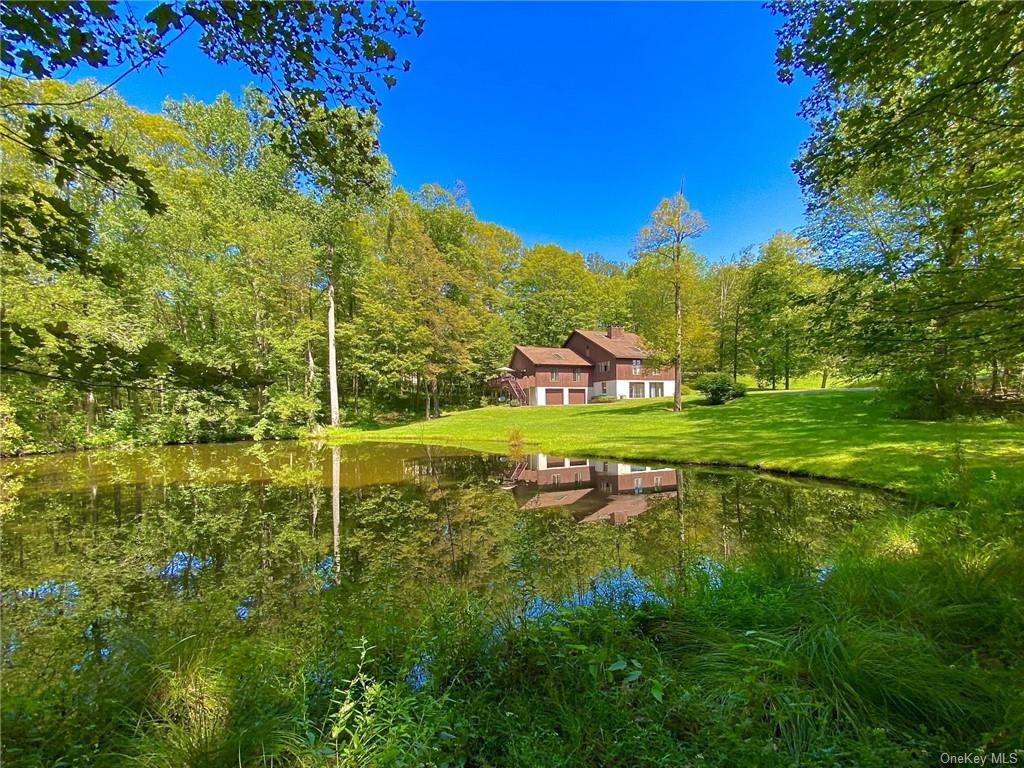 Home abuts gorgeous pond in back