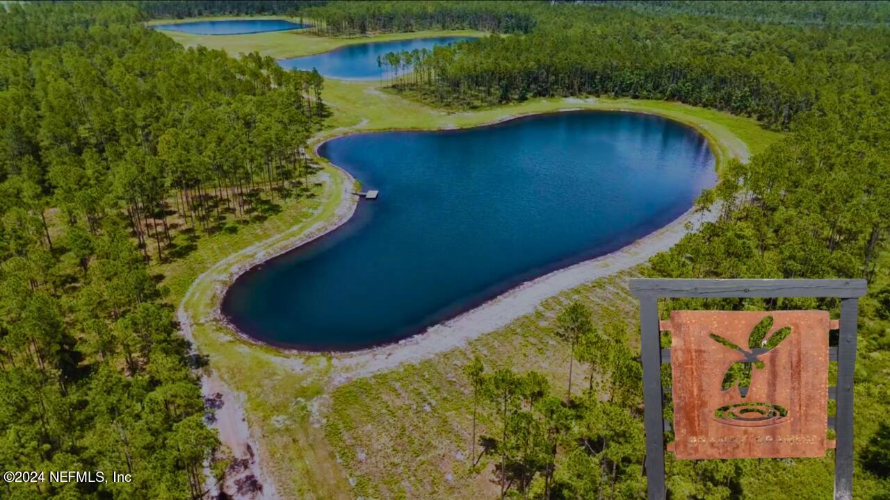 a view of a swimming pool with a yard