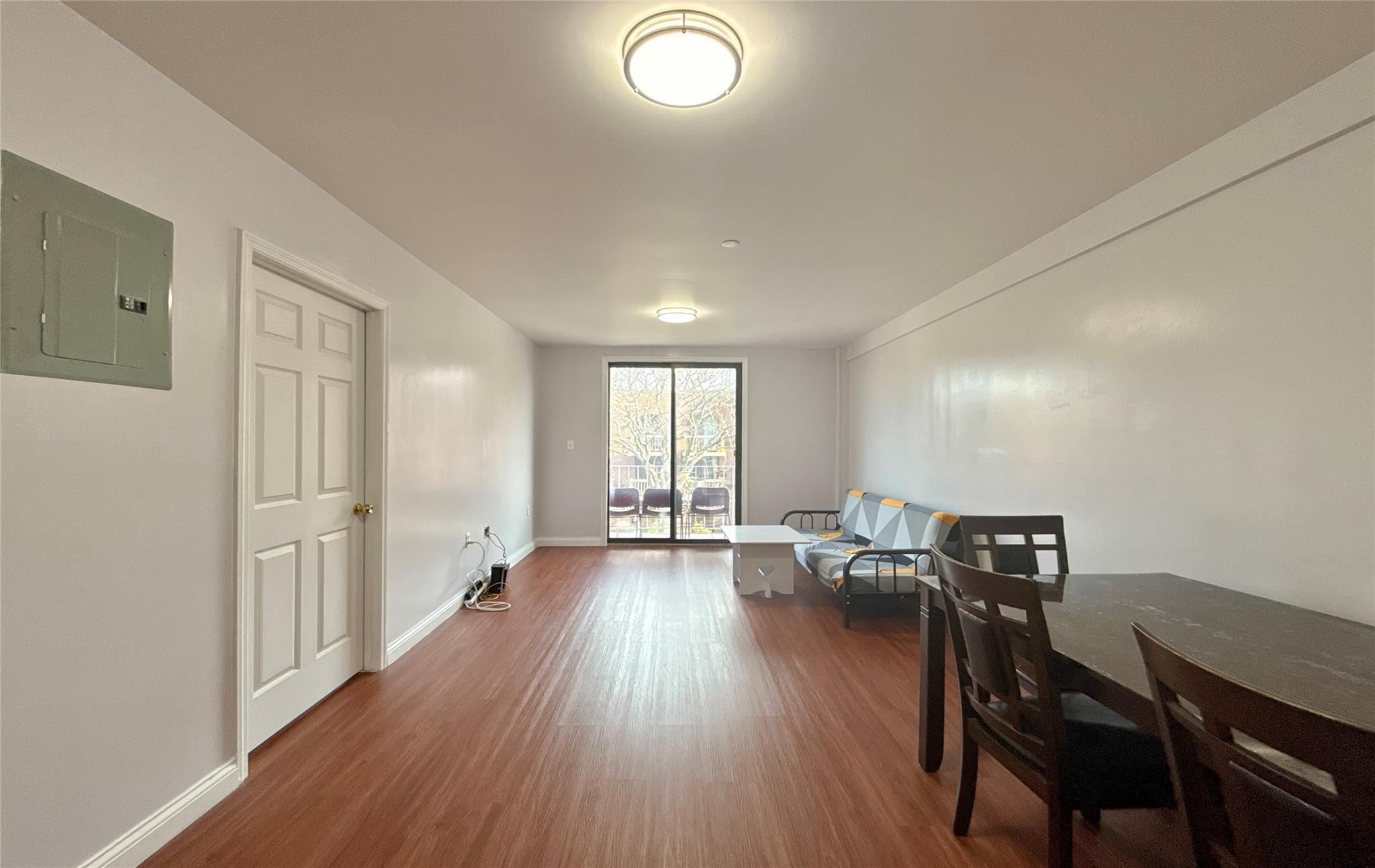 a view of a livingroom with furniture and wooden floor