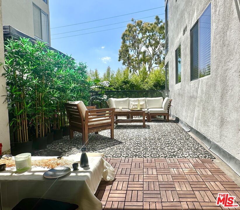 a backyard of a house with outdoor seating