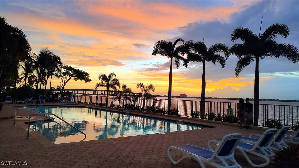 a view of swimming pool with a lounge chair