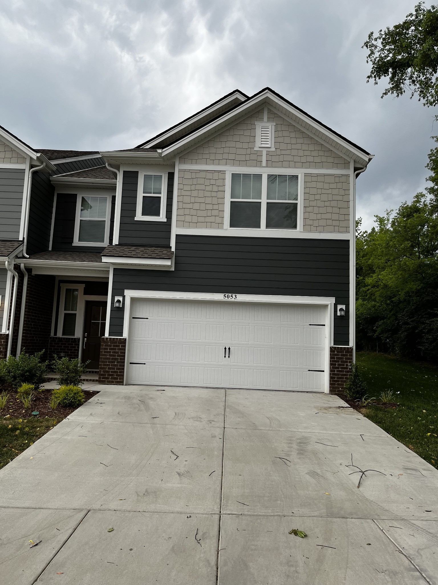 a front view of a house with garage