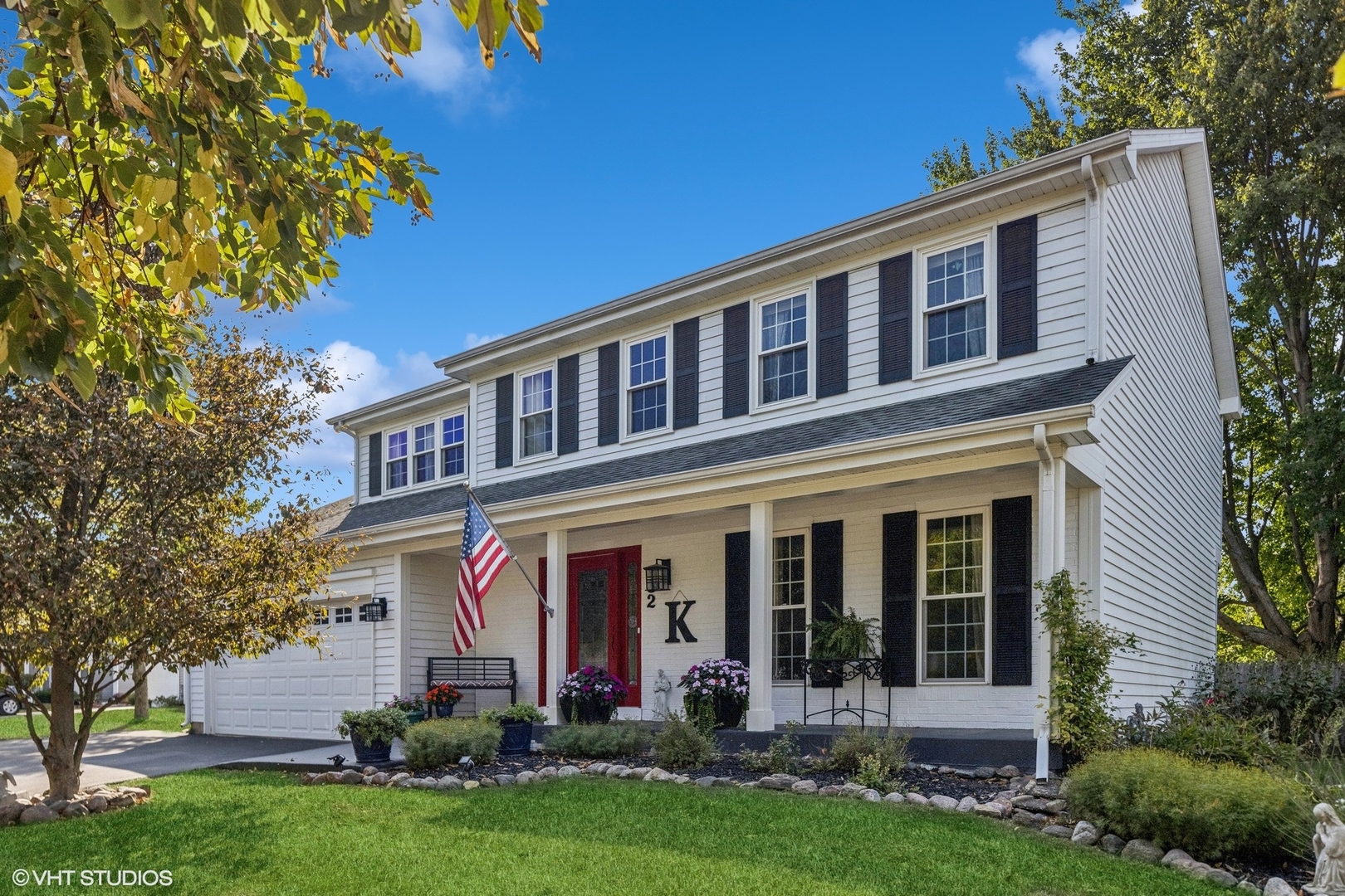 front view of a house with a yard