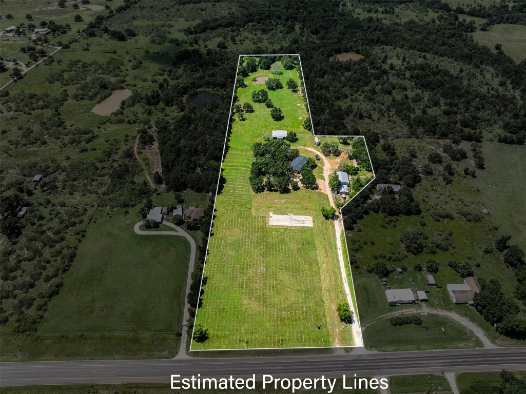 an aerial view of a residential houses with outdoor space