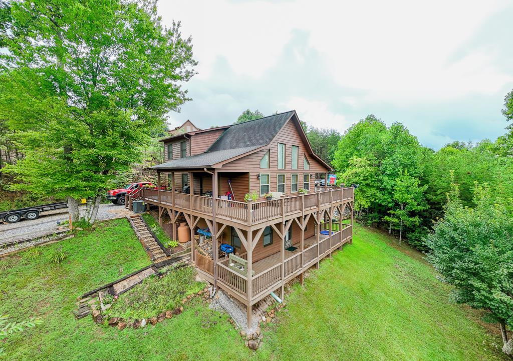 an aerial view of a house with a big yard